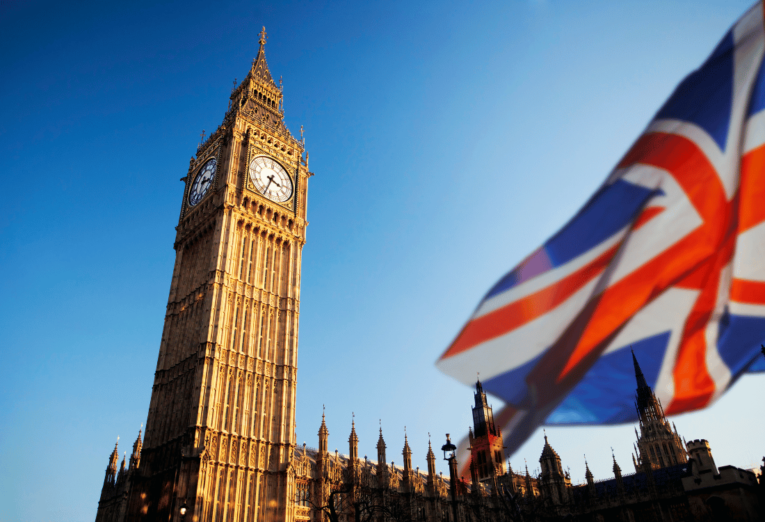 Big ben in the background with a union jack waving in the wind.